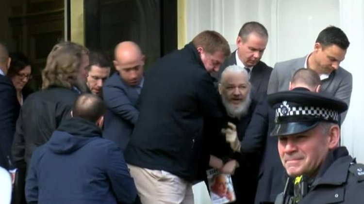 Assange supporters march through London streets