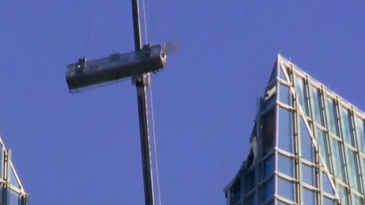 Two people trapped as window washer rig swings wildly in Oklahoma