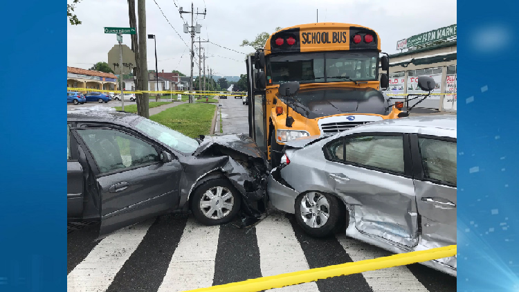 Two people sent to hospital after crashing into a school bus