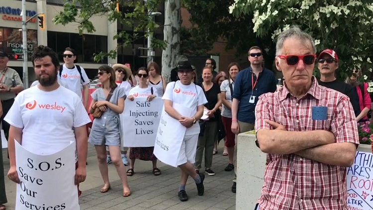 A rally at city hall to save the Wesley Day Centre