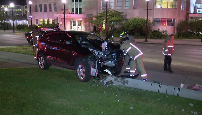 Woman charged after SUV slams into light pole in Hamilton