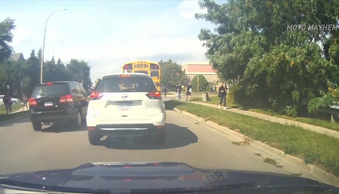 Driver caught on video passing a stopped school bus in Ancaster