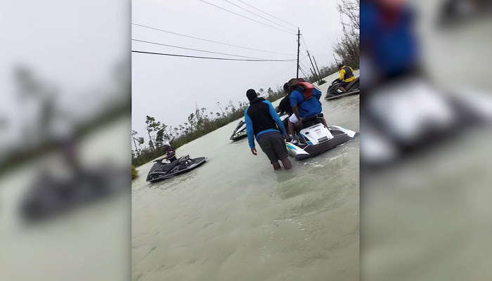 Jet skiers save 100 people trapped in flooded homes in the Bahamas