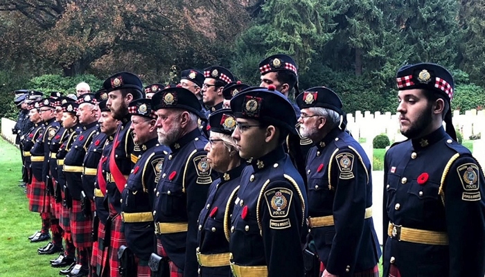 Halton police pipes & drums corps return from Europe where they remembered one of their own