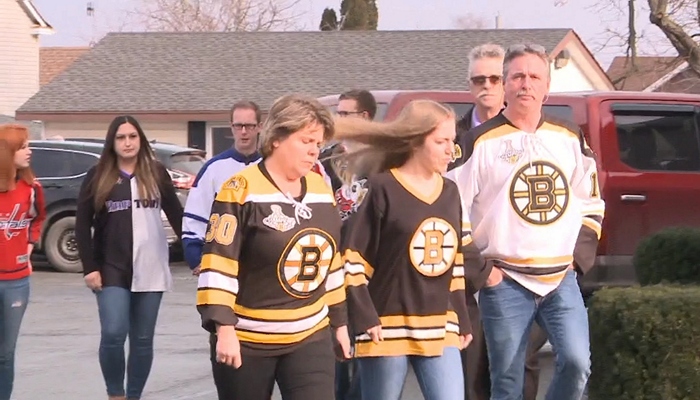 Crowds gathered in their favourite sports’ jerseys to remember Alex Luey