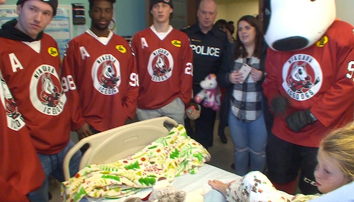 Niagara IceDogs deliver stuffed animals to children in hospital