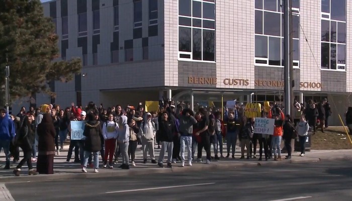 Students rally outside Bernie Custis after a black youth mentorship program is put on hold