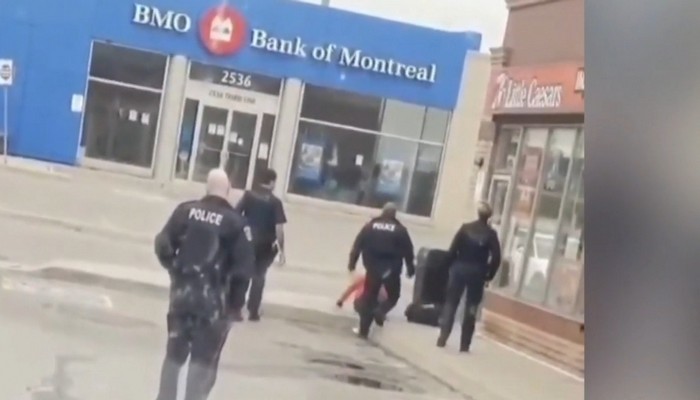 Halton police officer suspended after shoving a man in viral video