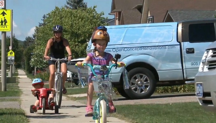 A four-year-old girl on a mission, pedalling every day to help raise money for research as her grandma battles cancer