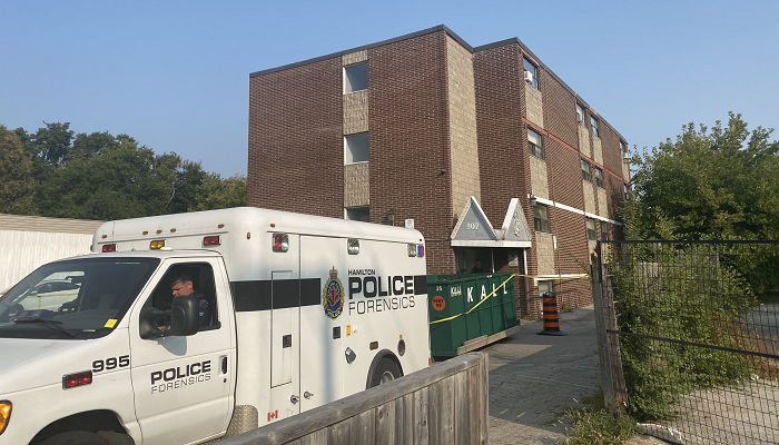 Man arrested after woman found dead in Hamilton apartment