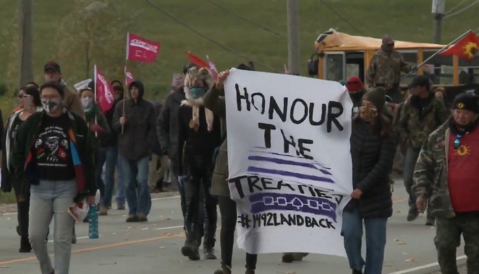 Protesters hold a peaceful march in Caledonia while misinformation spreads about organizers