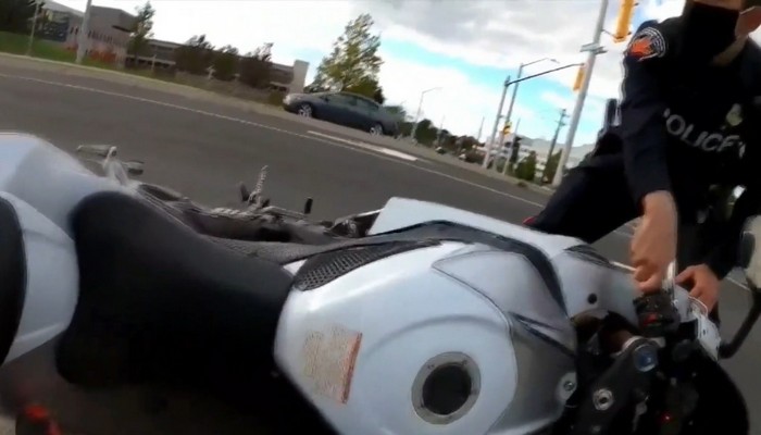 Hamilton police review video that appears to show an officer knocking a rider off his motorcycle