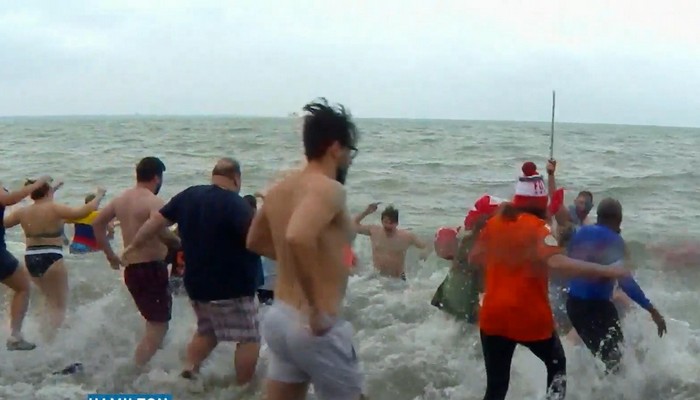 People took to the chilly waters of Lake Ontario for a New Year’s Day tradition
