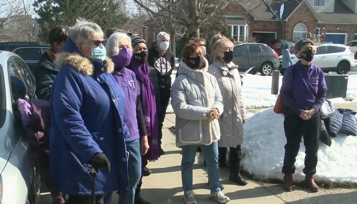 Local choir group performs for one of their own members battling cancer