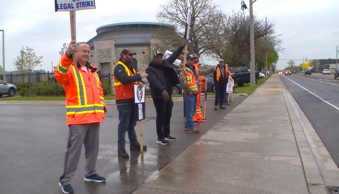 Members of the International Union of Operating Engineers picket at the Woodward treatment plant