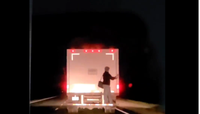 Police searching for a person that hitched a ride on the back of a truck in Norfolk