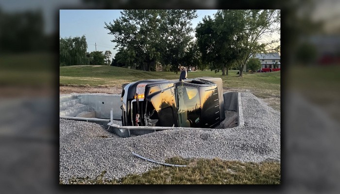 Man arrested after truck ends up in unfinished swimming pool