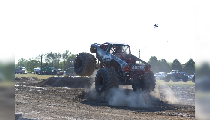 Monster trucks fly through the sky in Paris