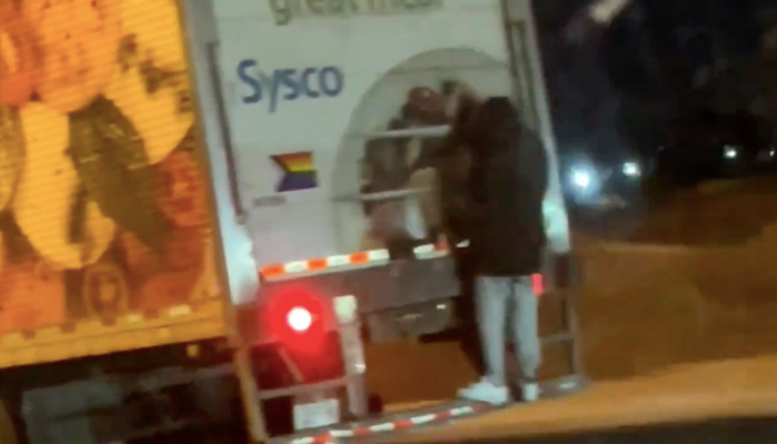 man on back of truck burlington