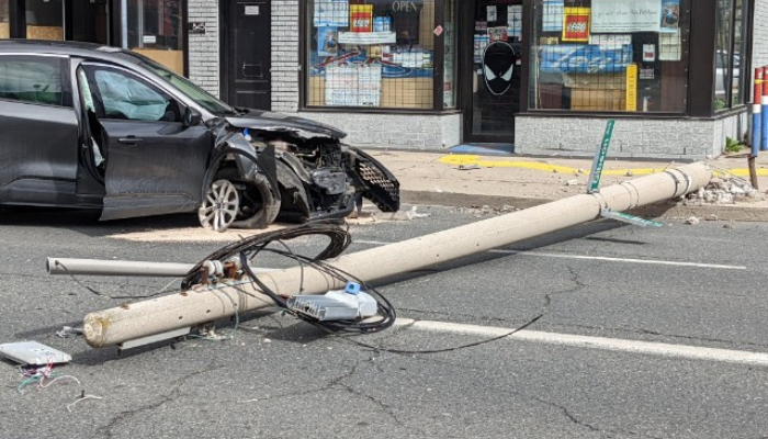 car hits hydro pole Hamilton