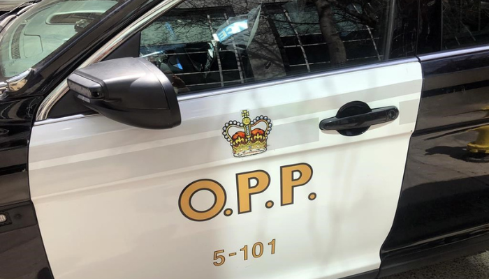 An Ontario Provincial Police vehicle sits idle in Toronto, Tuesday, April 11, 2023.