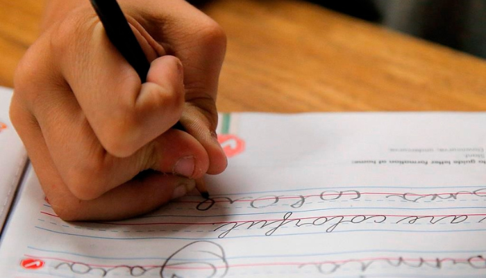 A student practices writing in cursive at St. Mark’s Lutheran School in Hacienda Heights, Calif., Thursday, Oct. 18, 2012.