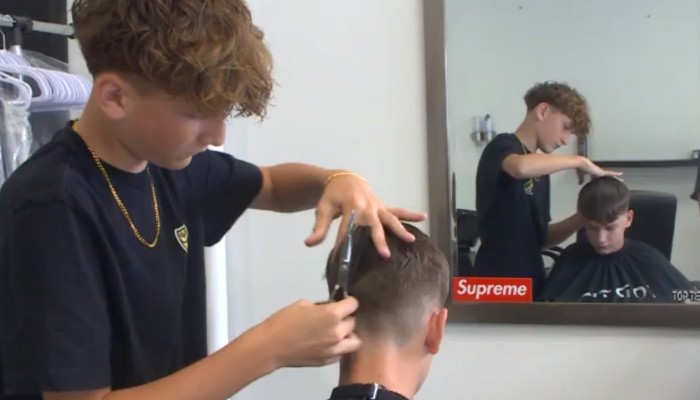 14-year-old working dream job at Oakville barbershop