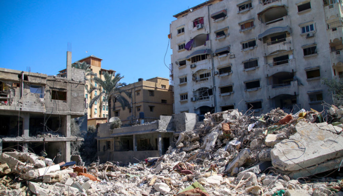 Palestinian citizens inspect damage to their homes caused by Israeli airstrikes on October 15, 2023 in Khan Younis, Gaza.