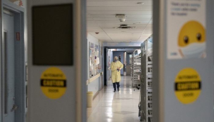 A healthcare worker is seen in the intensive care unit at Toronto’s Hospital for Sick Children, on Wednesday, Nov. 30, 2022.