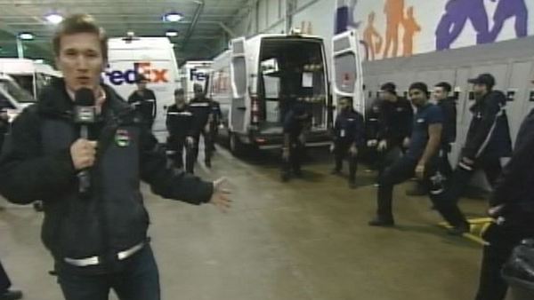 Phil Perkins with workers at FedEx's downtown Toronto depot; December 2, 2013