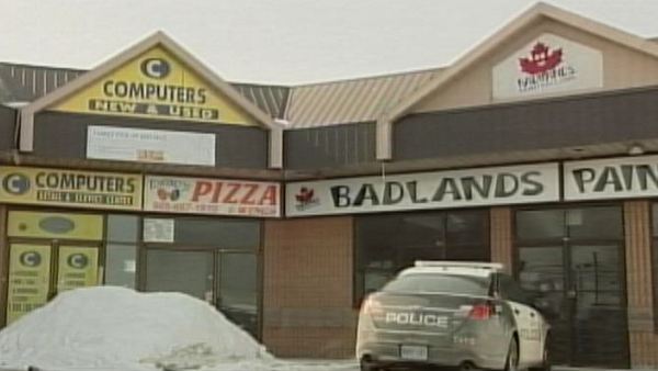 Police guard the scene of a suspicious fire at Torino's Pizza; Hamilton, February 17, 2014