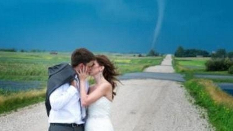 A couple kiss in front of a tornado (supplied photo)