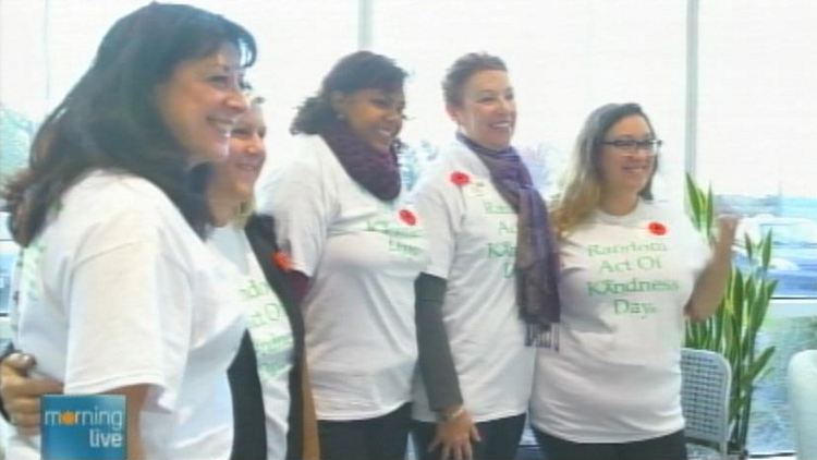 Handout image of Oakville Community Foundation members promoting 'random acts of kindness day'