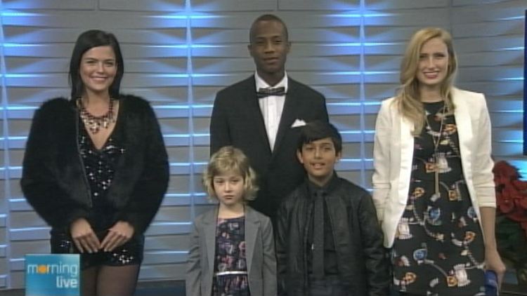 Models wearing H&M holiday fashions; Morning Live, December 17, 2014
