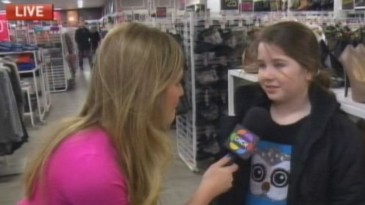 Jaclyn Colville with a young shopper at Eastgate Square; Morning Live, December 26, 2014