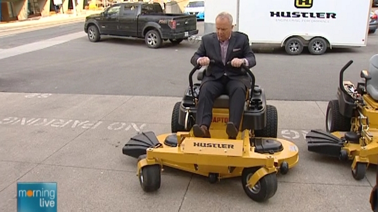 Bob Cowan rides a Hustler Turf mower; Morning Live, May 4, 2015