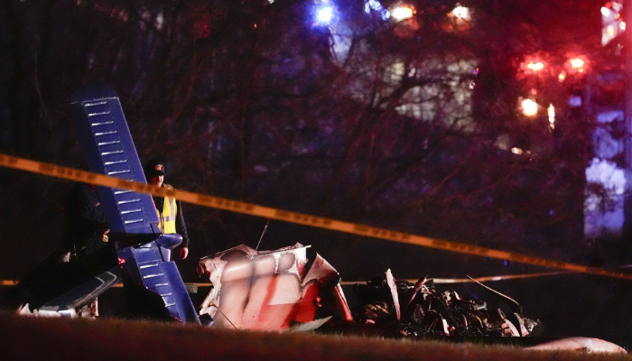 Emergency officials work the scene of a fatal small plane crash alongside Interstate 40 near mile marker 202, Monday, March 4, 2024, in Nashville, Tenn. An Ontario town is mourning a family of five who died in a Nashville plane crash earlier this week. THE CANADIAN PRESS/AP, George Walker IV