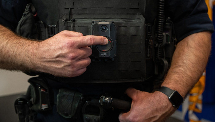 An overhaul of Ontario's 34-year-old law governing policing in the province is set to take effect next month, with its rules and regulations covering everything from oversight to discipline to how officers are equipped. A police officer demonstrates recording on a body camera during a news conference, in Surrey, B.C., on Thursday, Jan. 11, 2024. THE CANADIAN PRESS/Ethan Cairns