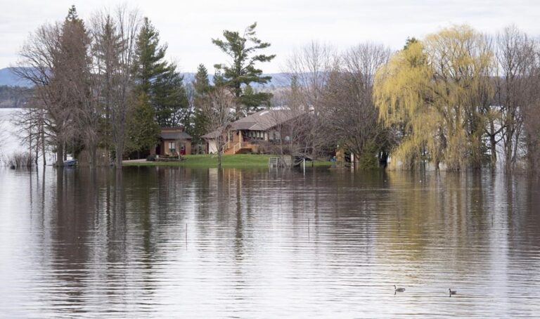 A home off of Beachburg Road by the Ottawa River in Whitewater Region, east of Pembroke, Ontario is completely surrounded by water as flooding continues in the region, on Saturday, May 11, 2019.